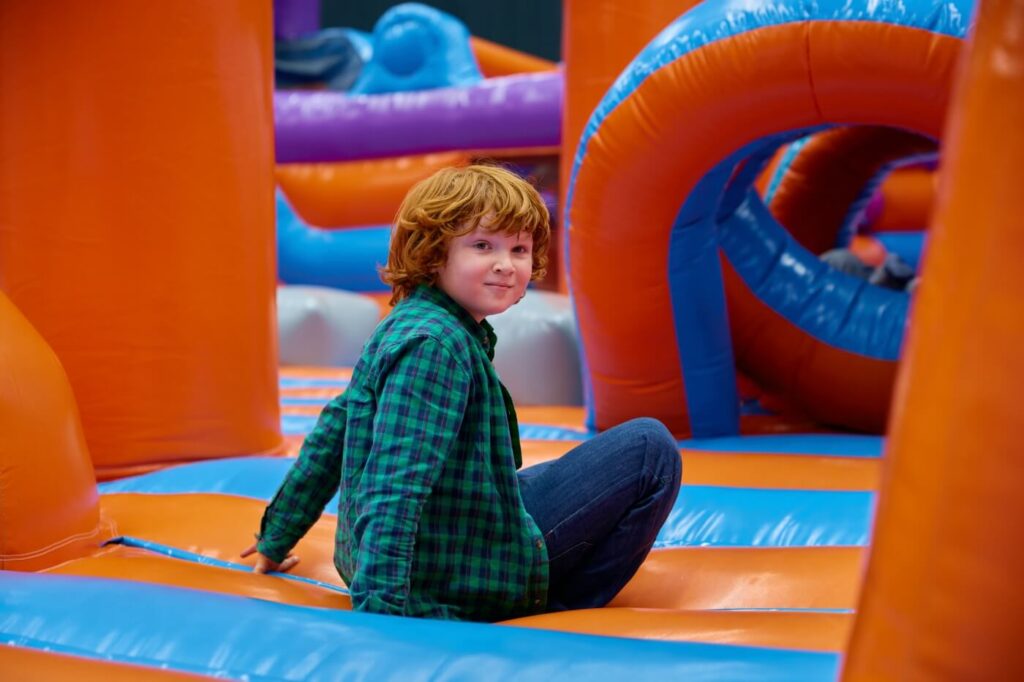 cute boy playing on inflatable bounce house in ent 2024 11 27 14 28 31 utc Homev2